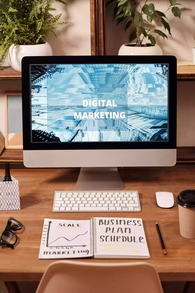 digital-marketing-on-laptop screen scale marketing on notepad